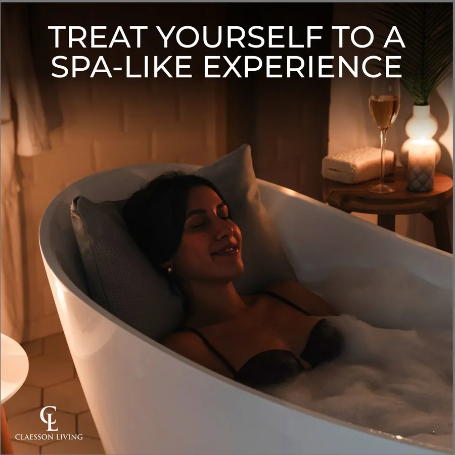 Woman relaxing in a candle-lit bath